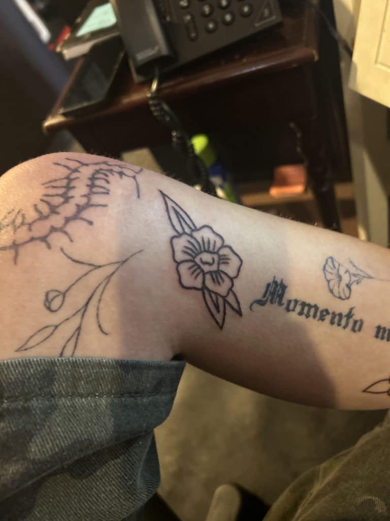 Simple traditional black ink flower tattoo from Mayhem Ink Tattoo, Nashua NH.