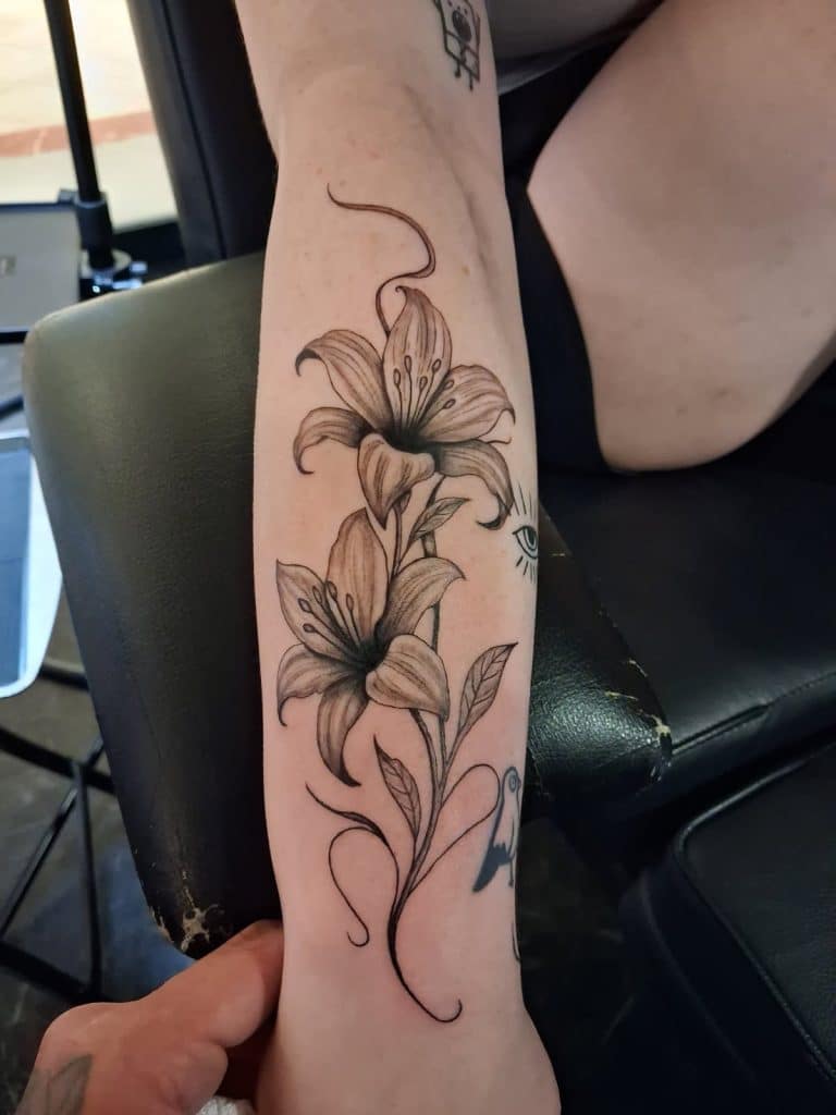 Black and grey custom floral tattoo by Jesse at Mayhem Ink Tattoo in Nashua, NH